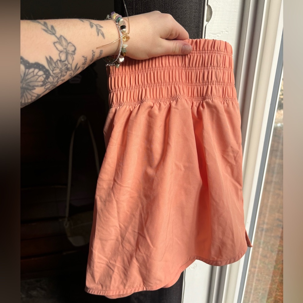 Peach coloured athletic shorts